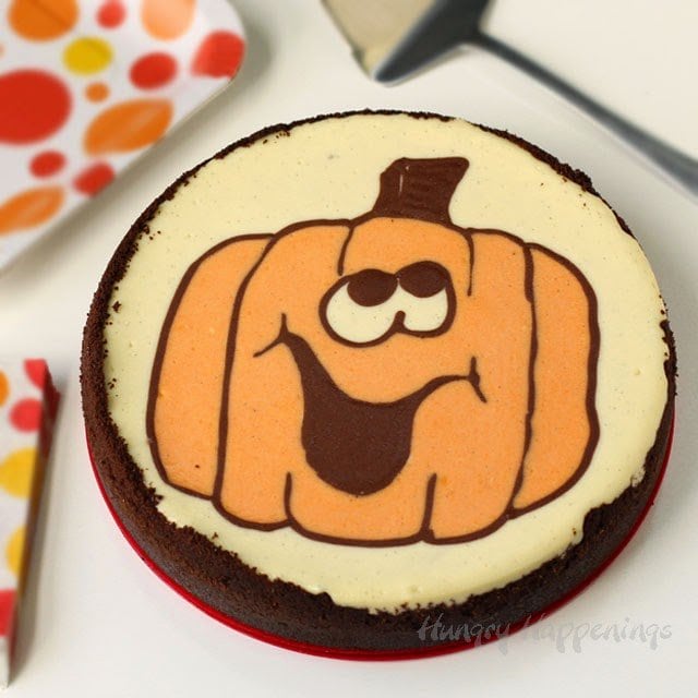 naturally colored cheesecake with a Jack-O-Lantern design on top