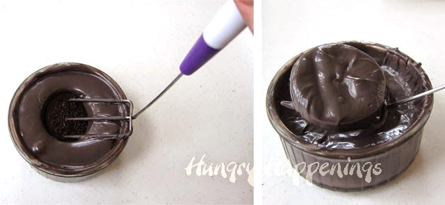 Dip the OREO Cookie into a bowl of melted black candy melts then remove using a candy dipping fork