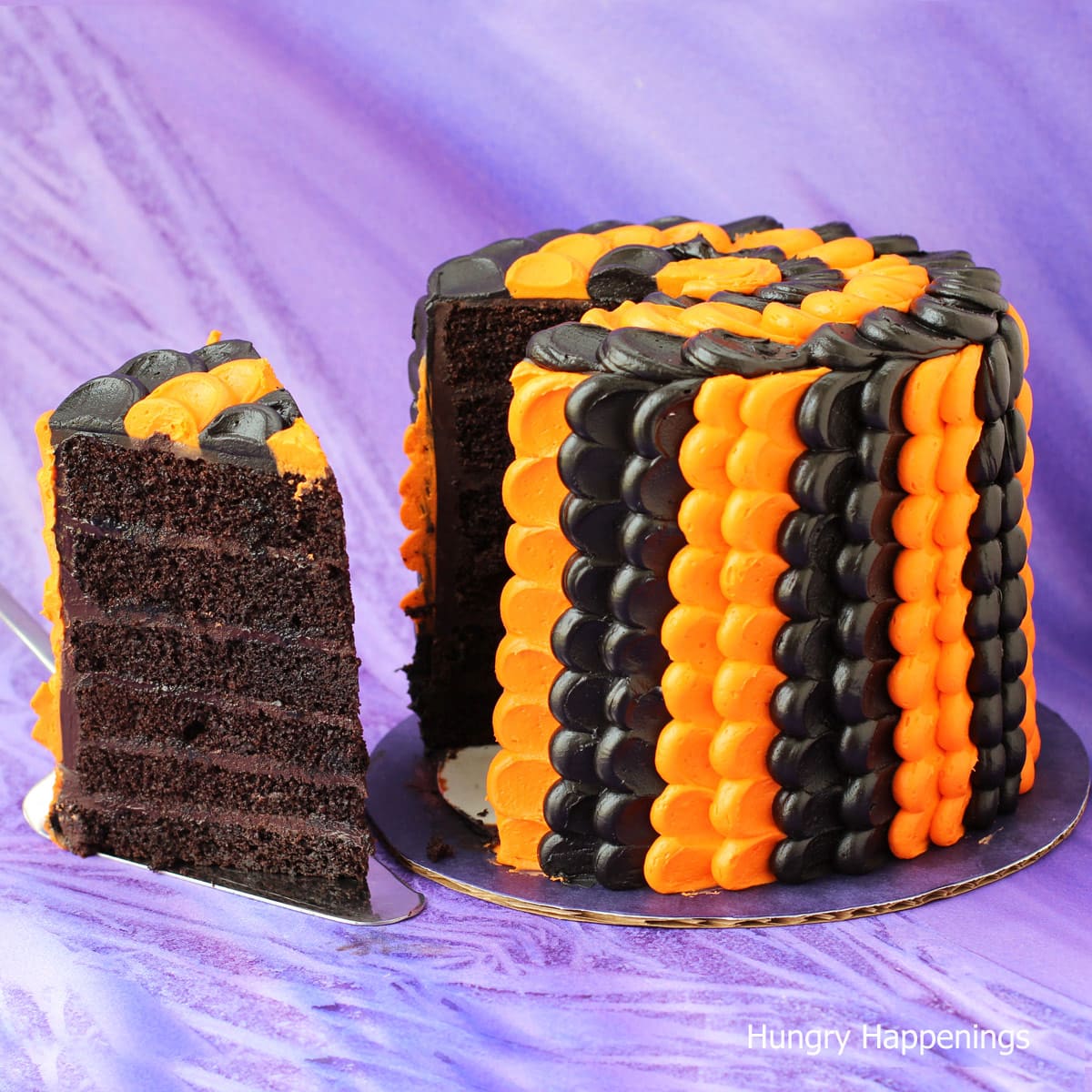 Halloween cake decorated with orange and black petals on a 6 layer chocolate cake. 