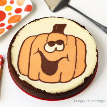 Halloween cheesecake decorated with a naturally colored jack-o-lantern.