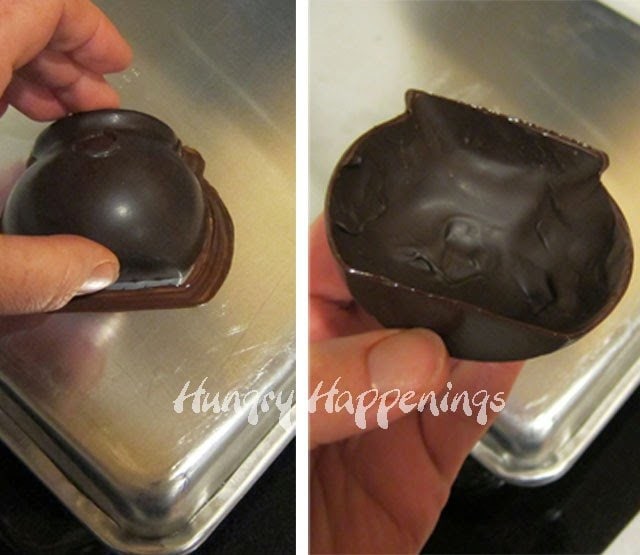 heating the edge of a chocolate cauldron on a cookie sheet so that it melts slightly.