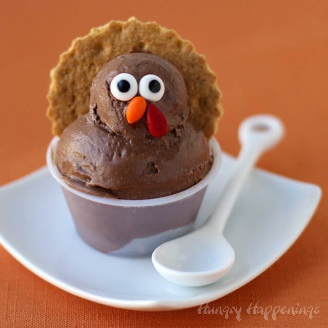cocoa banana ice cream turkeys decorated with candy eyes, beak, and wattle, and graham cracker feathers