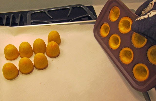 unmolding the yellow domes-shaped cookies. 