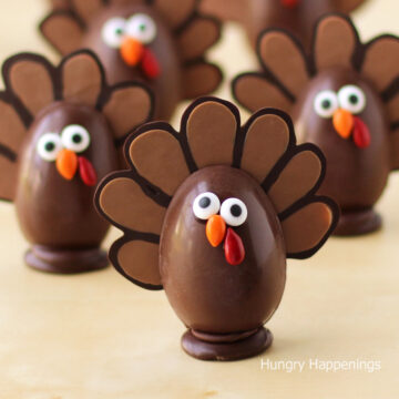 chocolate turkeys filled with pumpkin ganache and decorated with candy eyes and candy-coated sunflower seeds.