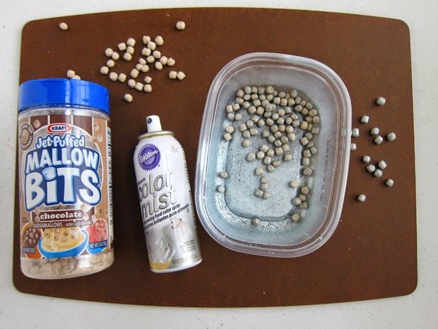 Spray Jet-Puffed Mallow Bits with Wilton Silver Color Mist to make hangers for Mega M&M Ornaments