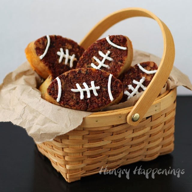 football-shaped bacon cheddar bread served in a basket. 