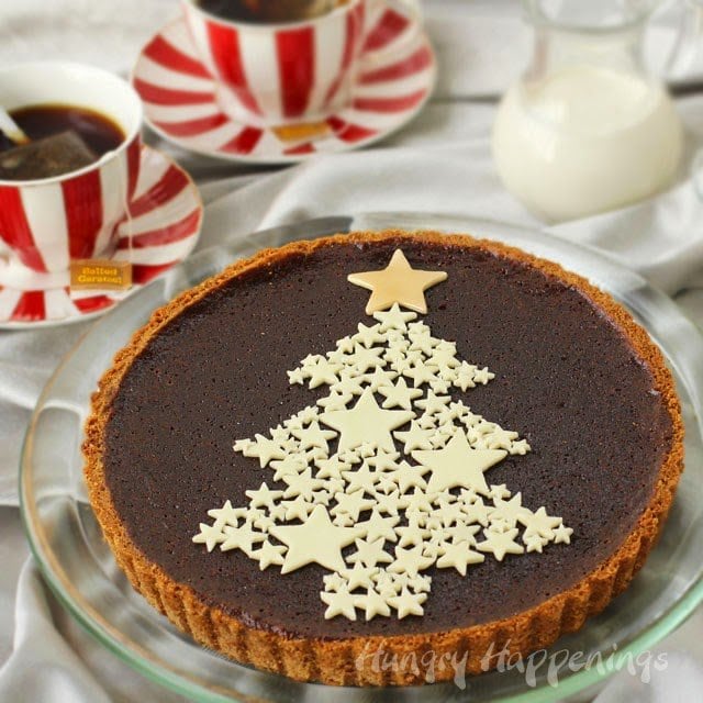 Chocolate tart topped with a white Christmas tree