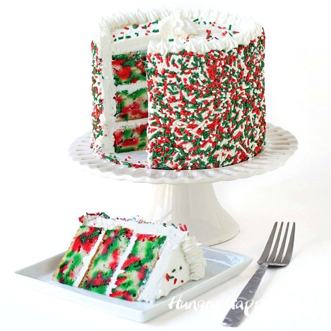 Christmas cake with red, white, and green tie-dye layers. 