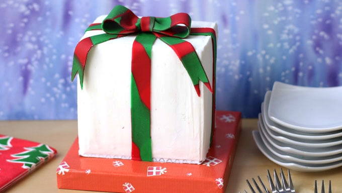 Christmas present cake with a red and green ribbon and bow. 