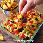 Hot taco dip is an easy appetizer to make for a New Year's Eve party, a Super Bowl party, or just about any party.