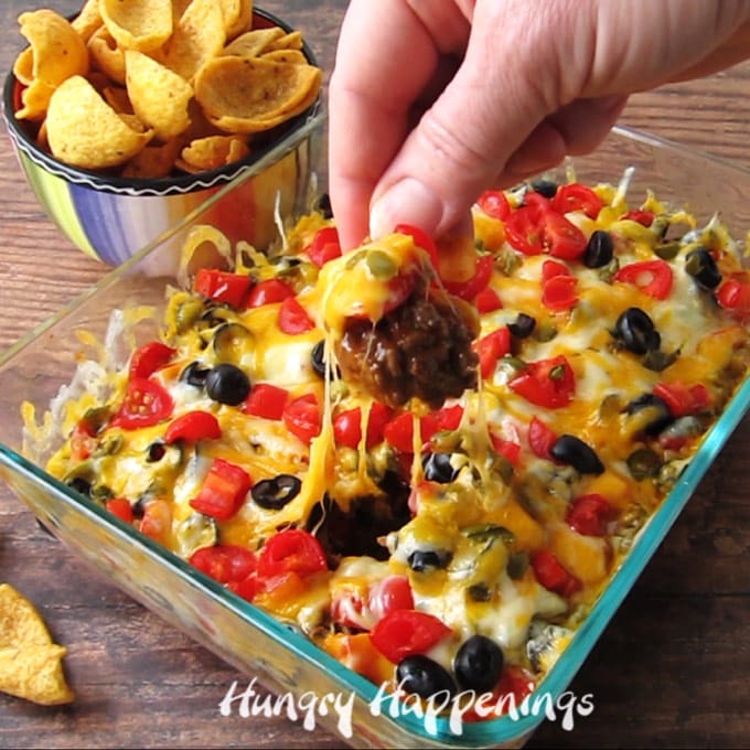 Hot taco dip is an easy appetizer to make for a New Year's Eve party, a Super Bowl party, or just about any party. 