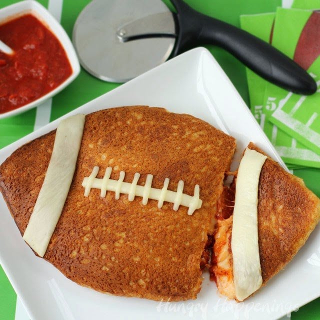 This week here at Hungry Happenings it is all about Super Bowl Party Food and today I'll share with you a super simple Stuffed Pizza Football. Don't order in pizza for the game but make your own and I guarantee you'll be satisfied.