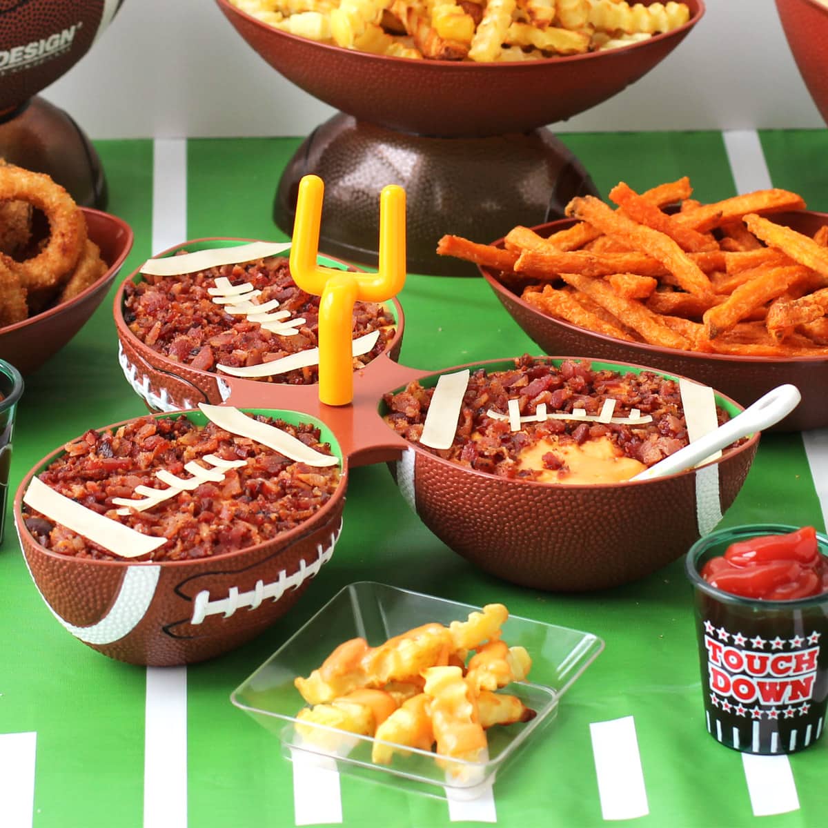 beer bacon cheese dip served in football bowls.