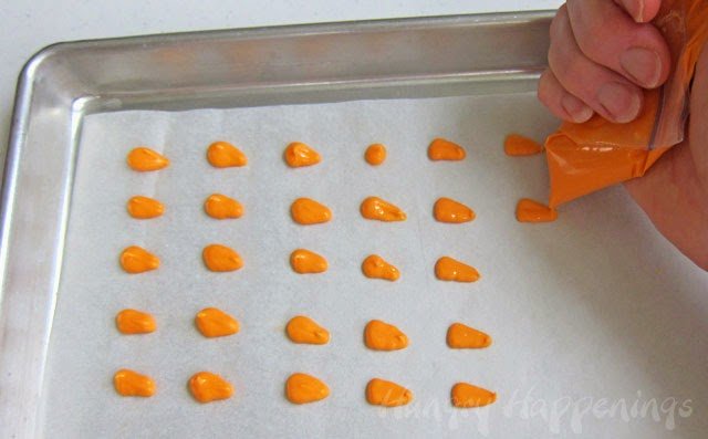 Make orange carrot noses to attach to snowman pretzels using orange candy melts. 