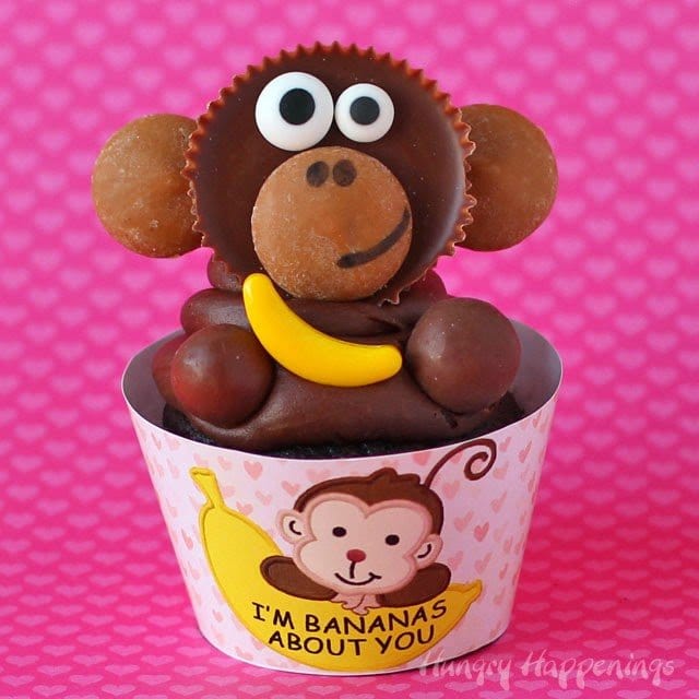 monkey cupcakes topped with a Reese's Cup monkey holding a candy banana. 