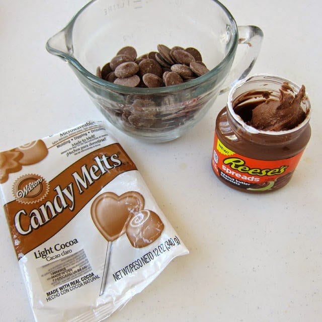 Light Cocoa Candy Melts and a jar of Reese's Spread. 