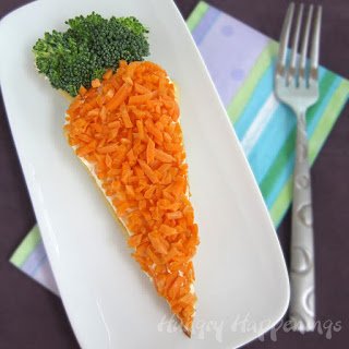 Have fun making a healthier Easter snack. These veggie pizza carrots will get your kids to eat their vegetables. 
