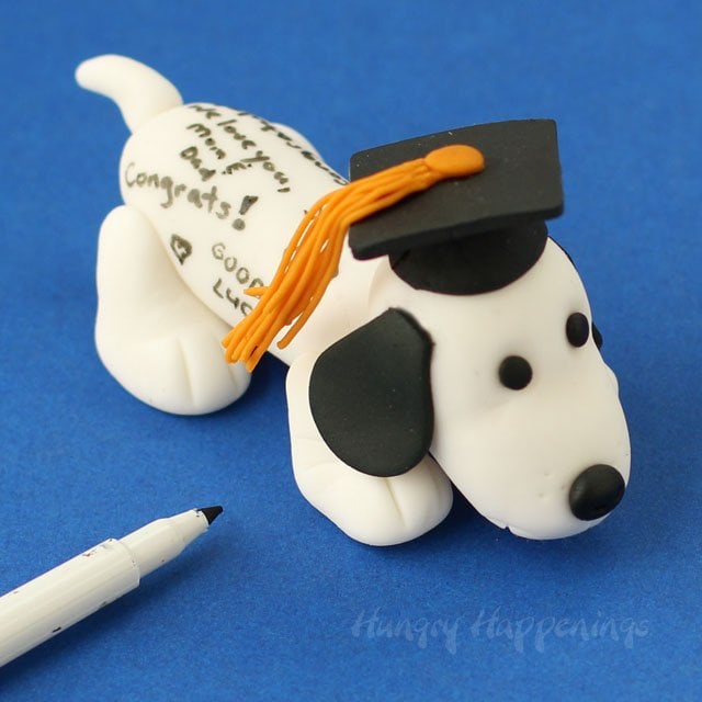 Top your graduation cake with this adorable Fondant Autograph Dog. Instructions at HungryHappenings.com