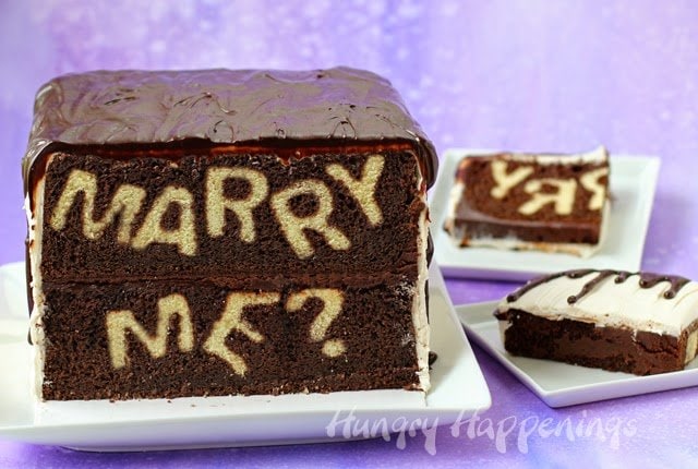 Slice into this decadent chocolate cake to reveal your proposal. Find the tutorial for this "Marry Me?" Reveal Cake at HungryHappenings.com