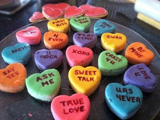 colorful conversation heart cheesecakes on a tray. 