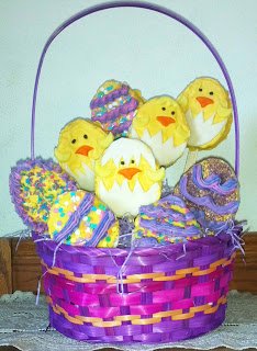egg-shaped Rice Krispie Treat chicks in a pink and purple Easter basket. 