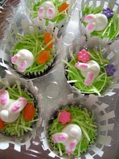 bunny butt cupcakes with edible Easter grass and candy carrots.