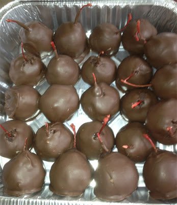 a tray of chocolate cherry bomb cake balls.