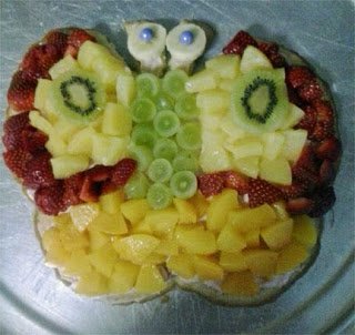 Maya's fruit pizza butterfly with pineapple, strawberries, grapes, mango, and kiwi. 