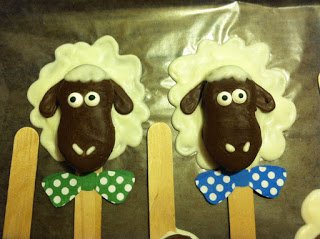 Lamb lollipops with green and blue polka dot bows. 