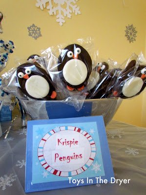 penguin Rice Krispie Treat pops displayed in a clear box. 