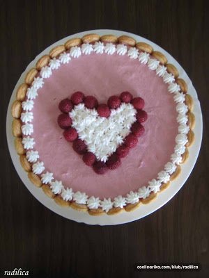 Valentine's Day mousse cake topped with araspberry heart.
