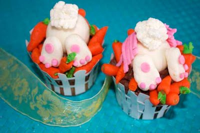 bunny butt cupcakes with big fluffy tails, floppy feet, and candy carrots. 