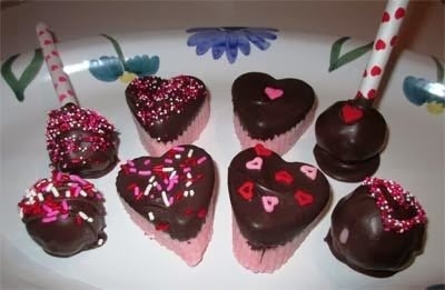 chocolate covered coconut candy hearts and pops. 