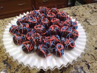 chocolate cherry bombs drizzled with red and blue chocolate. 