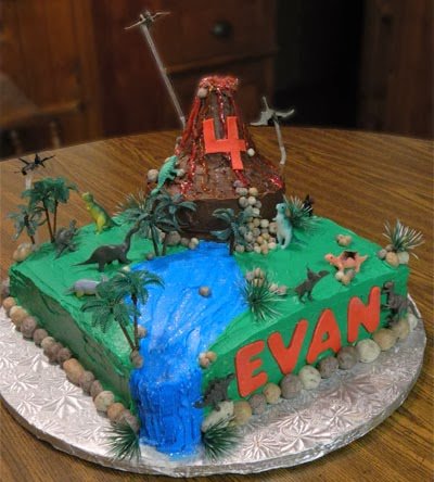 dinosaur cake with a volcano, flowing water, and fudge rocks. 