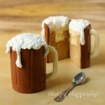 root beer mug cakes filled with vanilla ice cream ganache and topped with whipped cream foam
