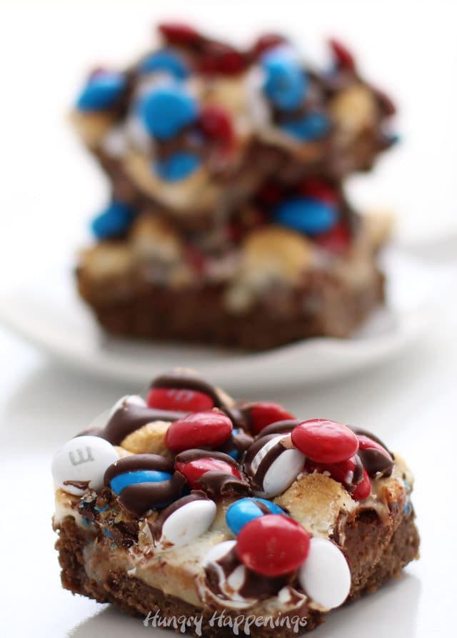 Red, white, and blue M&M topped S'mores Bars made using graham crackers, toasted marshmallows, and chocolate.