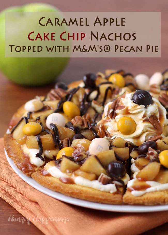 Cake Chip Nachos Topped with Cheesecake Fluff, Caramel Glazed Apples, Chocolate and Caramel Sauce, Toasted Pecans, and M&M's® Pecan Pie.