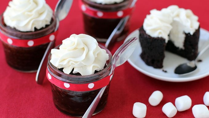 Mini Marshmallow Cream Cakes. Decadent chocolate cakes baked in mini mason jars are filled and topped with lots of marshmallow filling.