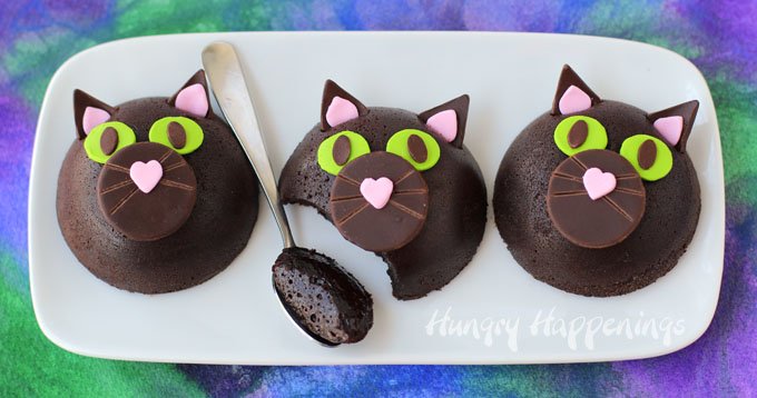 Deep dark flourless chocolate cakes decorated like cats make a decadent Halloween treat.