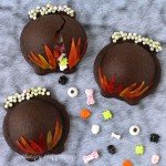 This Halloween you don't have to serve just cookies or just candy, these Candy Filled Cauldron Cookies combine them both. See the tutorial at HungryHappenings.com.