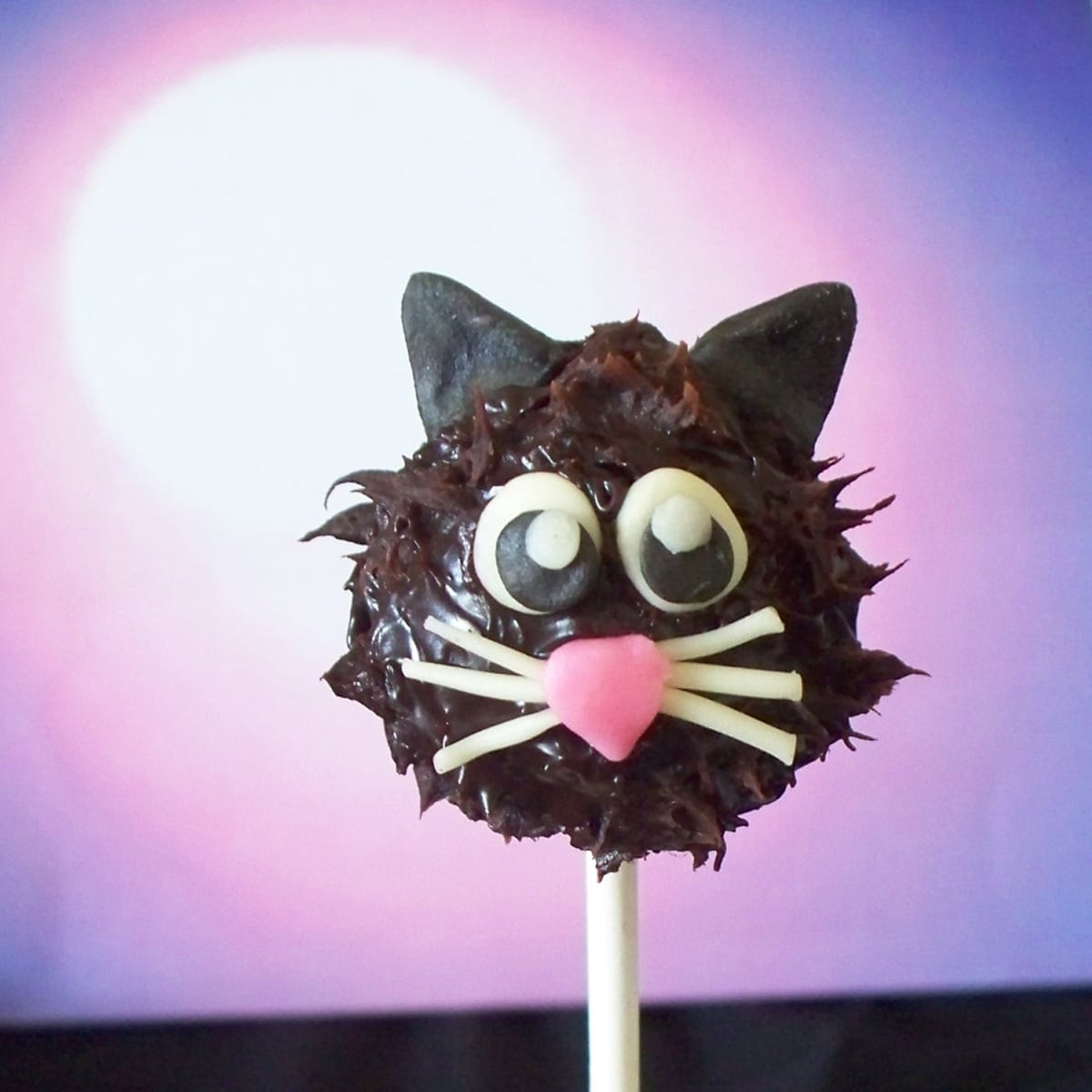 chocolate cat decorated with modeling chocolate.