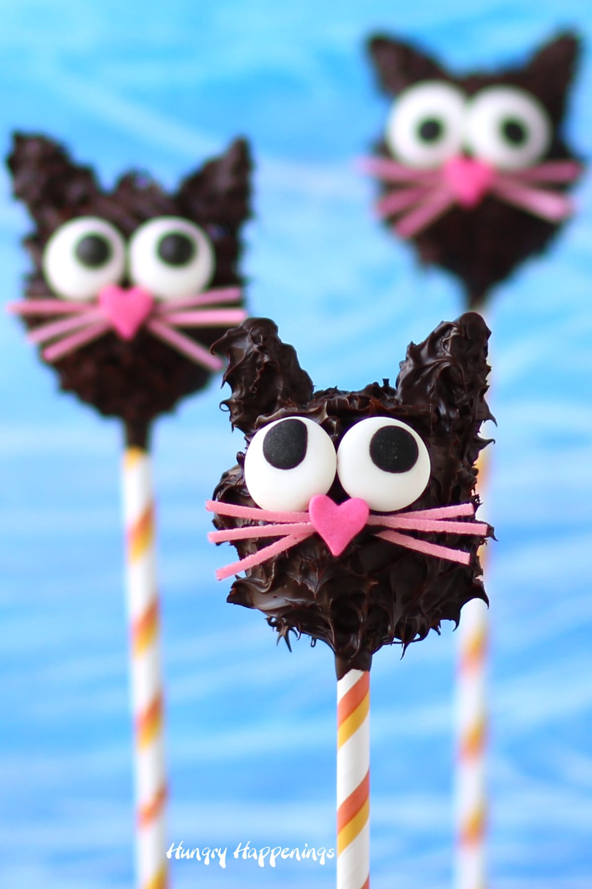 chocolate cats decorated with candy eyes, heart sprinkles, and edible Easter grass. 