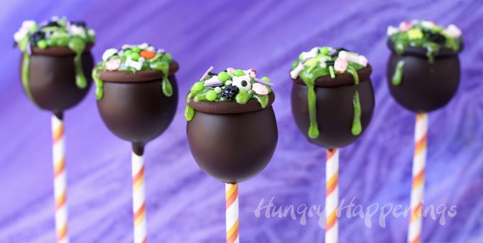 chocolate cauldrons filled with peanut butter fudge and topped with green icing and gory Halloween sprinkles. 