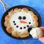 Warm up with winter with a skillet full of hot chicken dip surrounded by hot rolls. Scoop up the dip with the bread and enjoy. See the tutorial at Hungry Happenings.