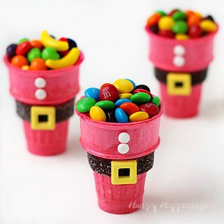 Easy Christmas treats for kids. These Santa Suit Candy Cups are made with a red ice cream cone and decorated with candy.