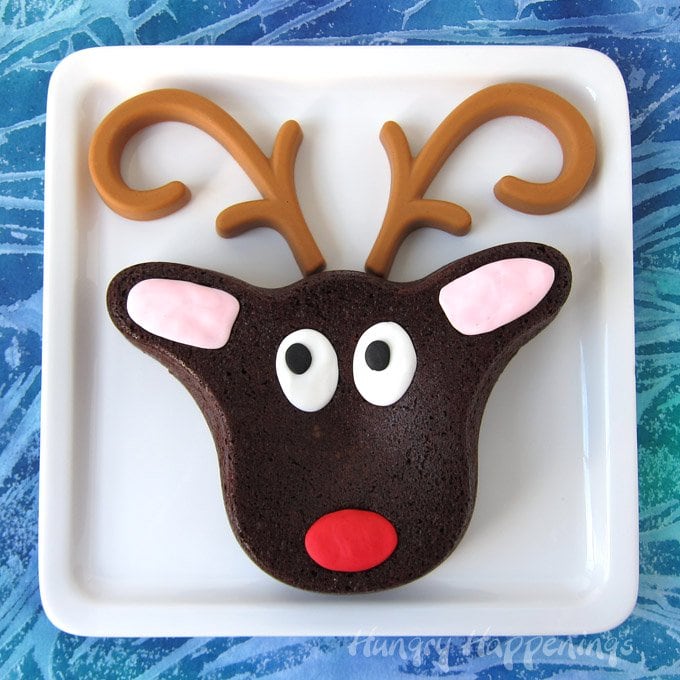 Cute Brownie Rudolph with Peanut Butter Candy Antlers is easy to make using a Wilton Reindeer Pan.