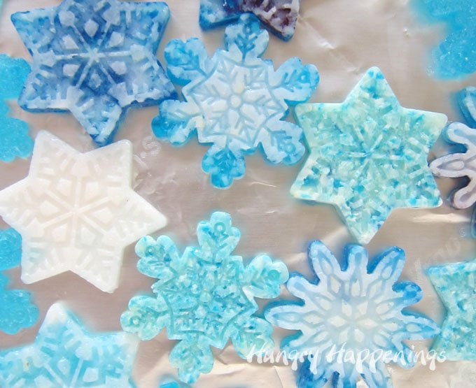 Melt blue and white hard candy to make these pretty snowflake candies. See how at HungryHappenings.com