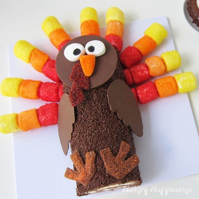 chocolate cake roll turkey decorated with sugar-coated marshmallows