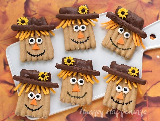 Combine salty and sweet to make these whimsical Thanksgiving treats. Each peanut butter and milk Chocolate Pretzel Scarecrow is adorably decorated to brighten up your holiday dessert table.